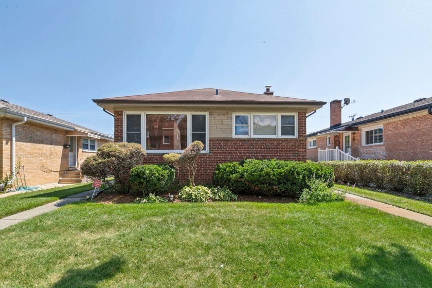 Freshly painted, move-in ready brick ranch. This home features - Beach Home for sale in Skokie, Illinois on Beachhouse.com