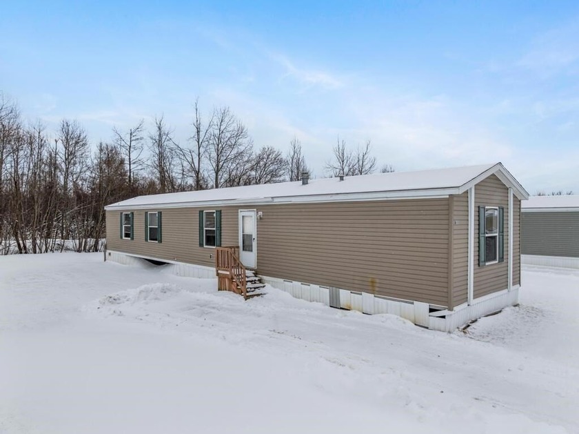 Located in the Conway Commons Community, this 2016 home offers - Beach Home for sale in Alanson, Michigan on Beachhouse.com