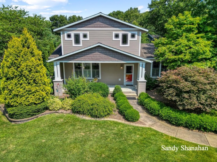 With a beautiful yard and immaculate interior this home is ready - Beach Home for sale in Saugatuck, Michigan on Beachhouse.com