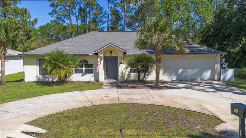 SELLER FINANCING! This attractive 4-bedroom, 2-bath pool home - Beach Home for sale in Palm Coast, Florida on Beachhouse.com