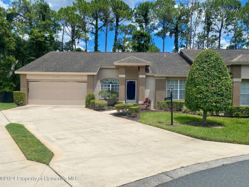 This charming two-bedroom, two-bathroom split-bedroom Villa with - Beach Home for sale in Spring Hill, Florida on Beachhouse.com