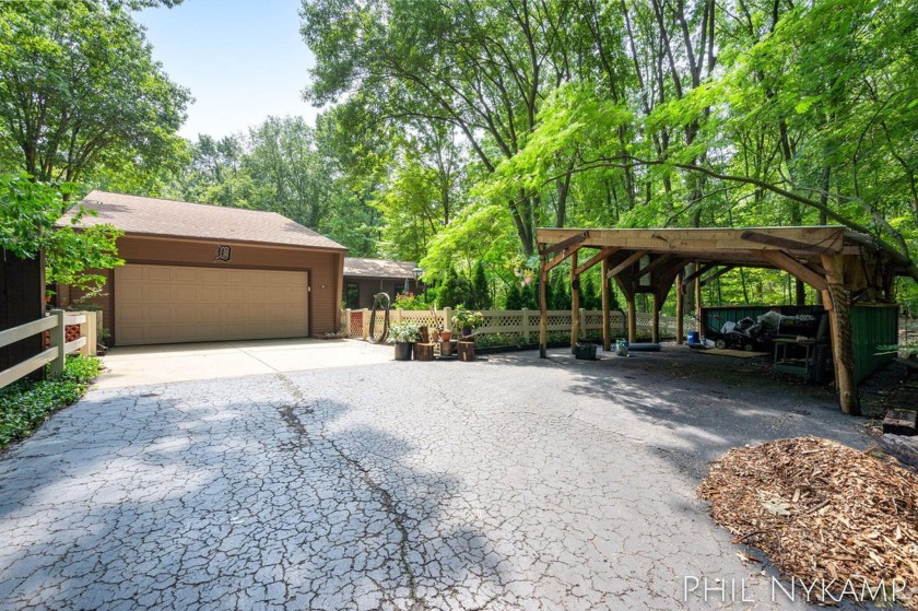 This beautiful property, nestled on nearly 3.5 acres of serene - Beach Home for sale in Holland, Michigan on Beachhouse.com