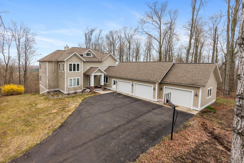Perched on a hilltop with expansive Crooked Lake and valley - Beach Home for sale in Petoskey, Michigan on Beachhouse.com