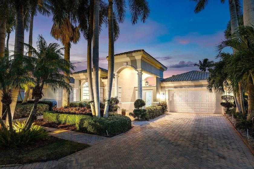 Nestled in the exclusive Isles at Hunters Run Country Club, this - Beach Home for sale in Boynton Beach, Florida on Beachhouse.com