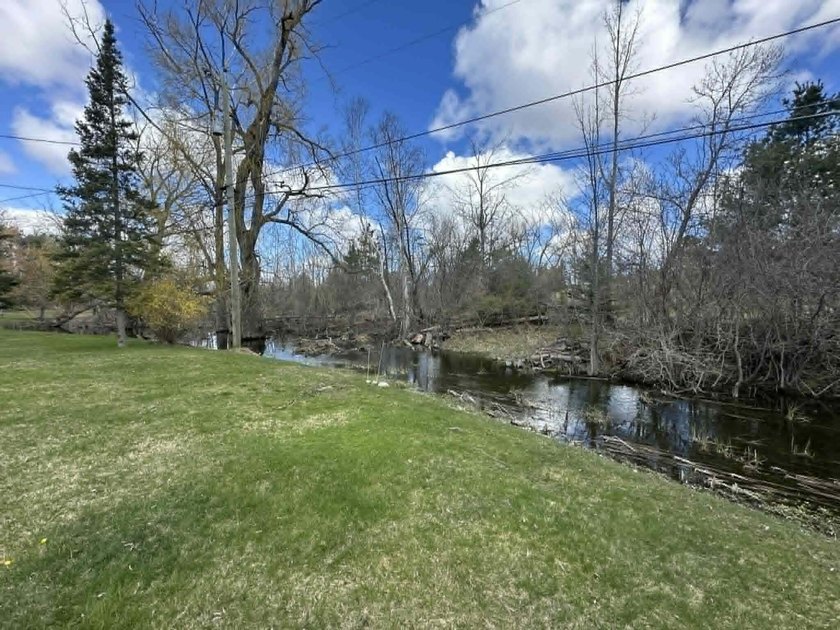 Spacious and inviting 4-bedroom, 3-bath home featuring warm - Beach Home for sale in Alpena, Michigan on Beachhouse.com