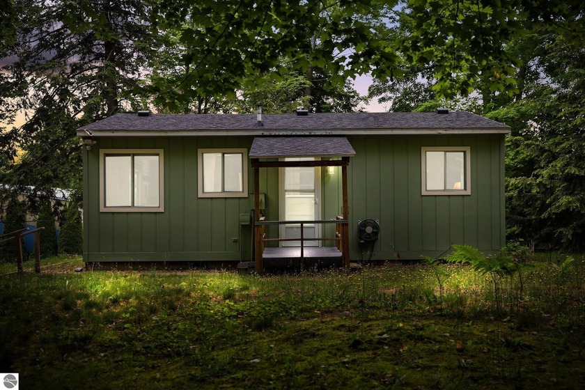 Nestled on 2.15 acres of whispering hardwoods and gentle streams - Beach Home for sale in Northport, Michigan on Beachhouse.com