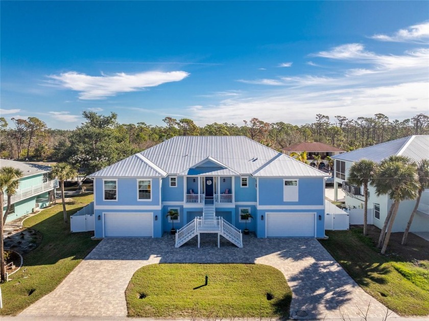 Completed in 2021, this CUSTOM-DESIGNED WATERFRONT RETREAT - Beach Home for sale in Englewood, Florida on Beachhouse.com