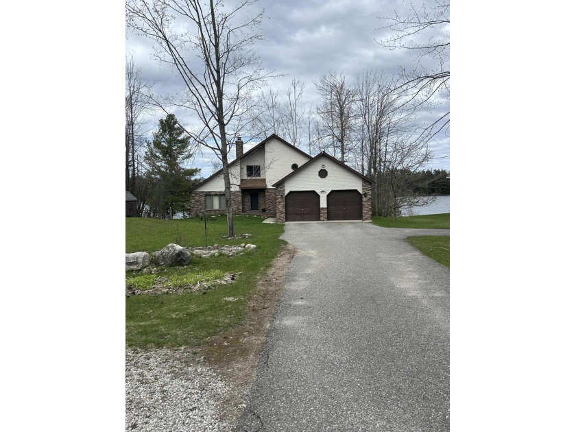 Lakefront living at its finest. Wake up to breathtaking sunrises - Beach Home for sale in Cheboygan, Michigan on Beachhouse.com