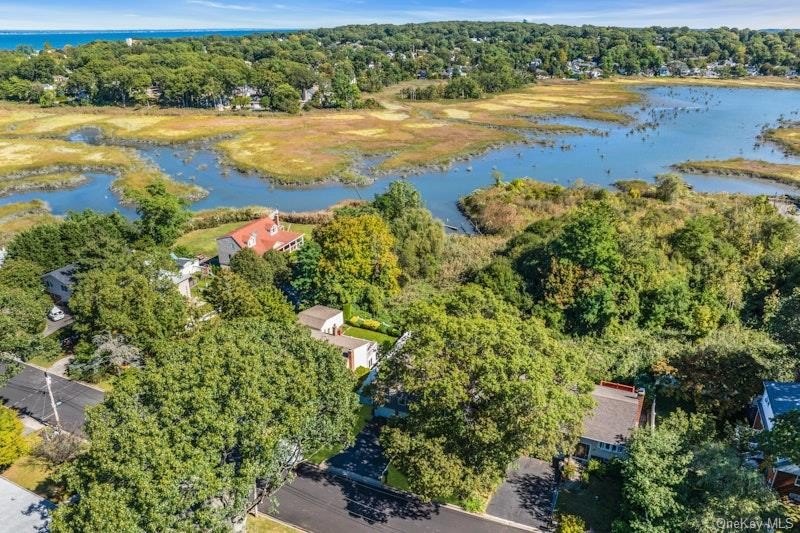 Nestled within the charming town of Locust Valley, this bayfront - Beach Home for sale in Locust Valley, New York on Beachhouse.com