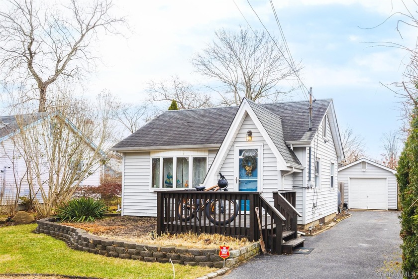 Welcome to 278 W Elm Road in Mastic Beach, a charming home that - Beach Home for sale in Mastic Beach, New York on Beachhouse.com