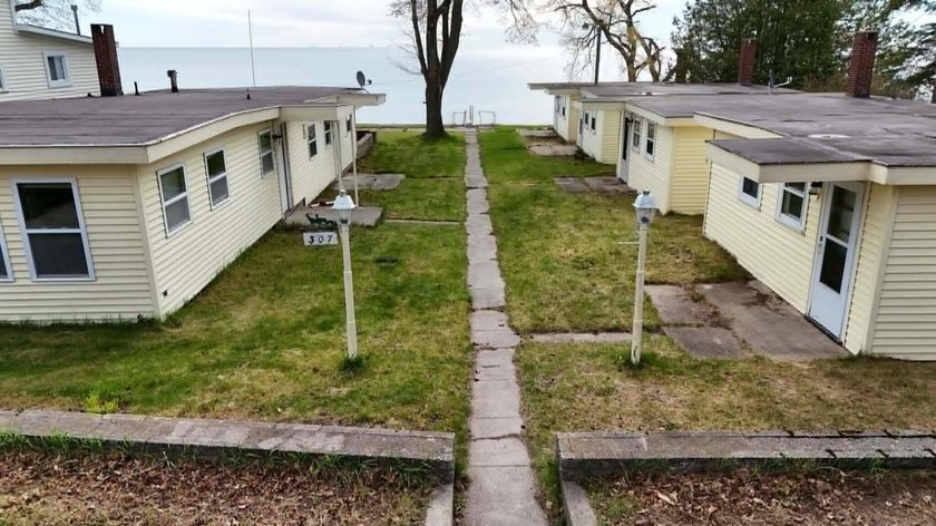 Rare opportunity, 5 Cabins in downtown harrisville with 77ft of - Beach Home for sale in Harrisville, Michigan on Beachhouse.com