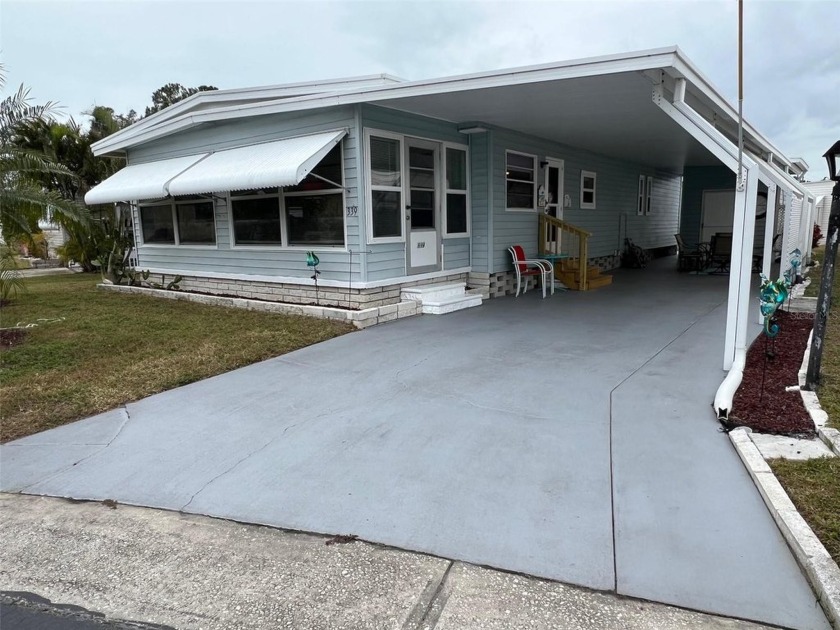 Tucked away on a serene cul-de-sac, this stunning turn key - Beach Home for sale in Largo, Florida on Beachhouse.com