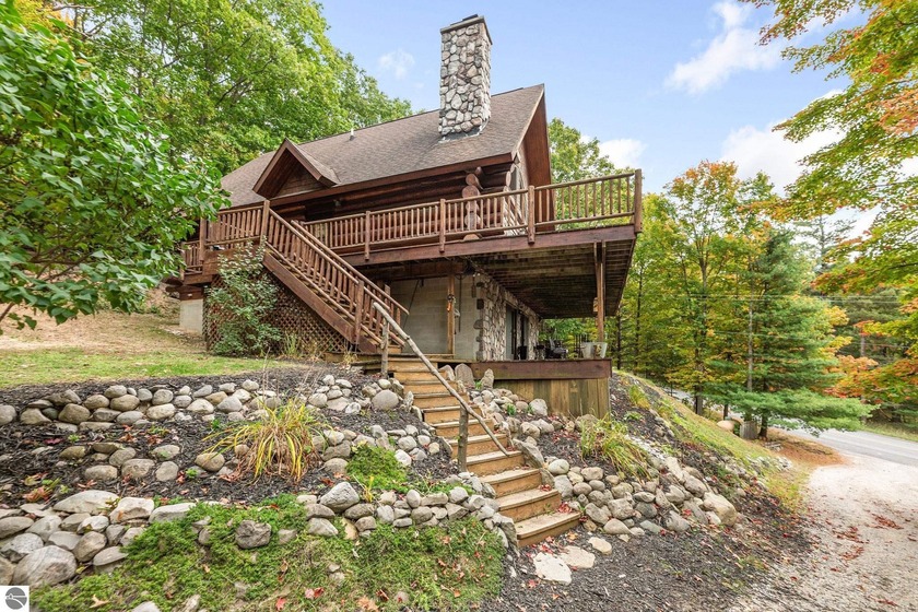 Experience classic Up North living in this custom full-scribed - Beach Home for sale in Maple City, Michigan on Beachhouse.com