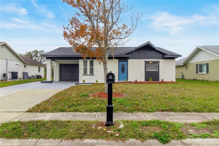 This fully renovated lake house offers modern updates and - Beach Home for sale in New Port Richey, Florida on Beachhouse.com