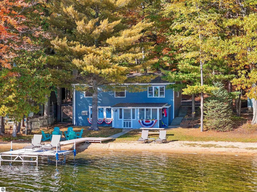 This charming Spider Lake cottage offers the perfect Up North - Beach Home for sale in Traverse City, Michigan on Beachhouse.com