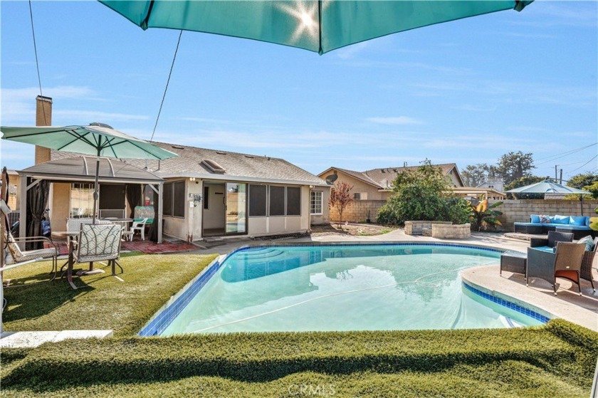 This stunning single-level home features a beautiful pool and a - Beach Home for sale in Lake Forest, California on Beachhouse.com