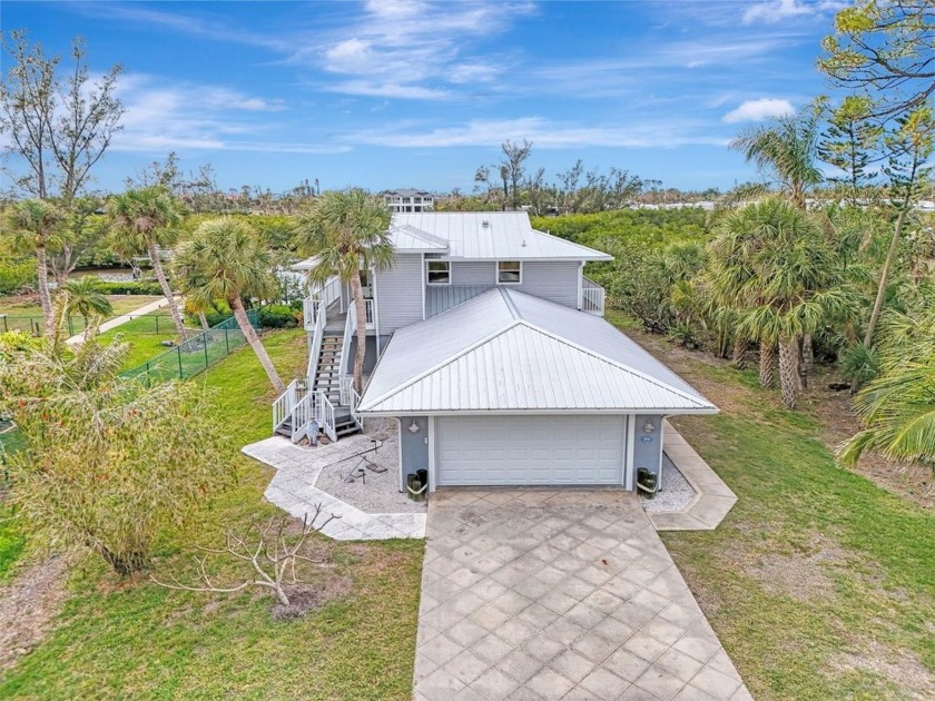 Welcome to this charming waterfront coastal cottage, offering - Beach Home for sale in Englewood, Florida on Beachhouse.com