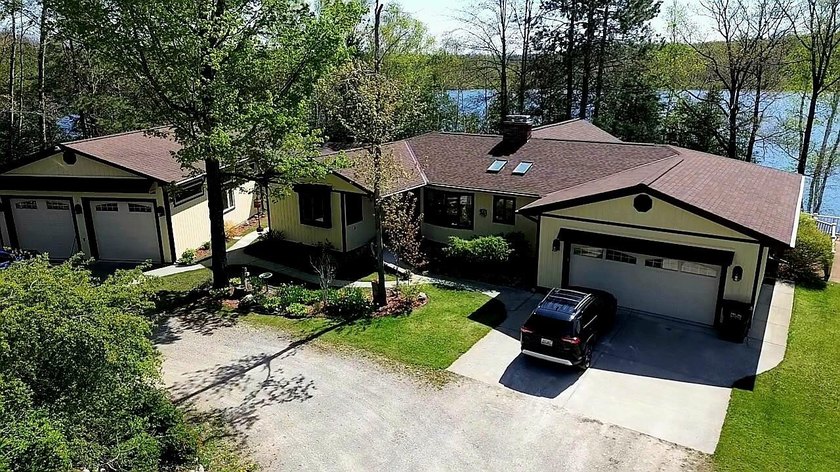 Welcome to this beautiful, sprawling ranch with serene lakefront - Beach Home for sale in Ocqueoc, Michigan on Beachhouse.com
