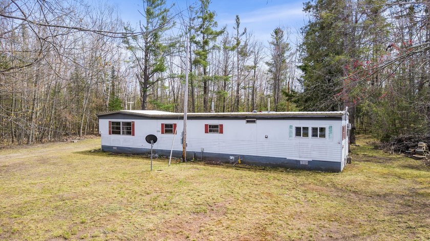 Great income-producing opportunity! This 3-bedroom, 1-bath home - Beach Home for sale in Cheboygan, Michigan on Beachhouse.com