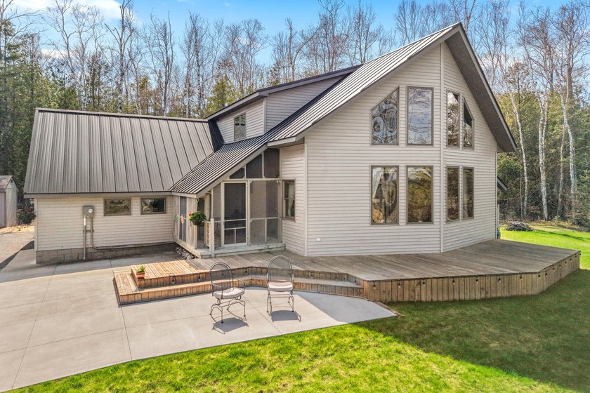 Best of both worlds! This secluded contemporary home sits on 10 - Beach Home for sale in Rogers City, Michigan on Beachhouse.com
