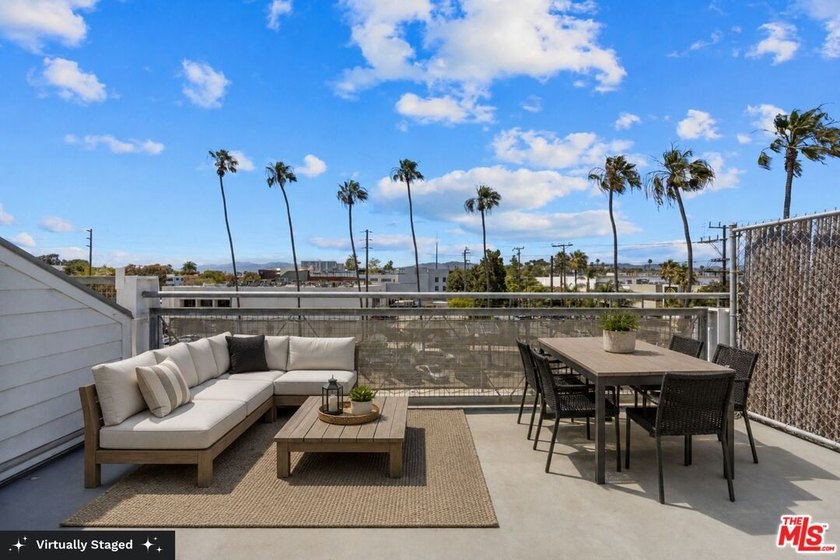 A private rooftop deck with sweeping sunset views sets the tone - Beach Condo for sale in Venice, California on Beachhouse.com
