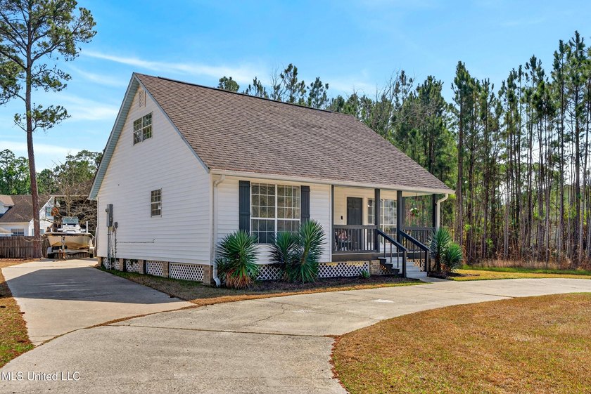 Fully renovated and thoughtfully designed in Timber Ridge, this - Beach Home for sale in Pass Christian, Mississippi on Beachhouse.com