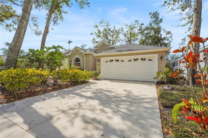 Nestled within the canopy trees, welcome to this gated 3-bedroom - Beach Home for sale in Sarasota, Florida on Beachhouse.com