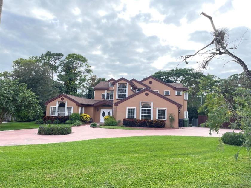 Nestled on a lush .57 acre cul-de-sac  in sought after - Beach Home for sale in Wellington, Florida on Beachhouse.com