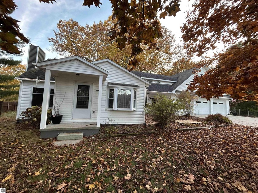 Nestled in a park-like setting, this wonderful home offers the - Beach Home for sale in Tawas City, Michigan on Beachhouse.com