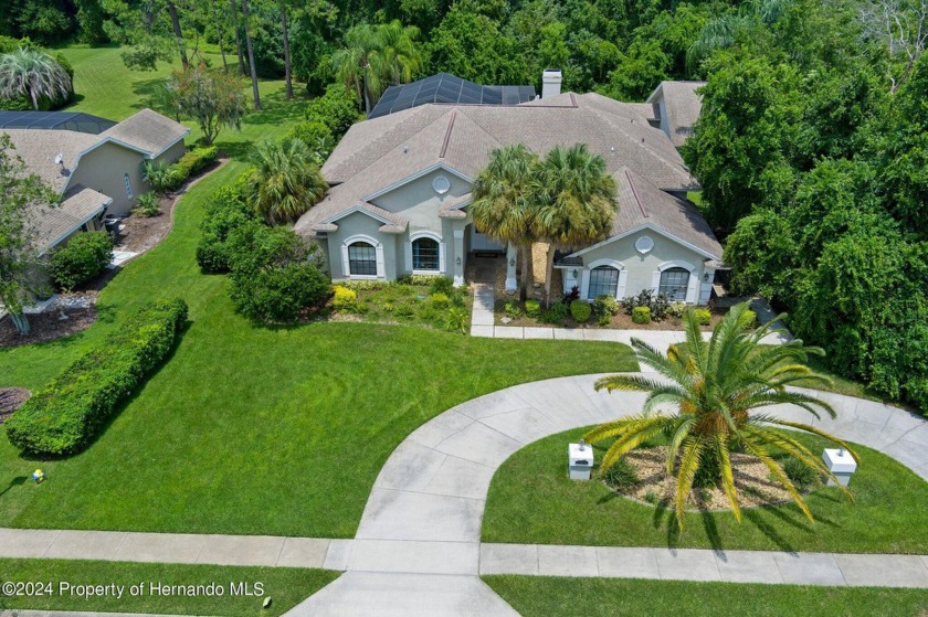 Nestled within the sought-after Lake in the Woods gated - Beach Home for sale in Spring Hill, Florida on Beachhouse.com