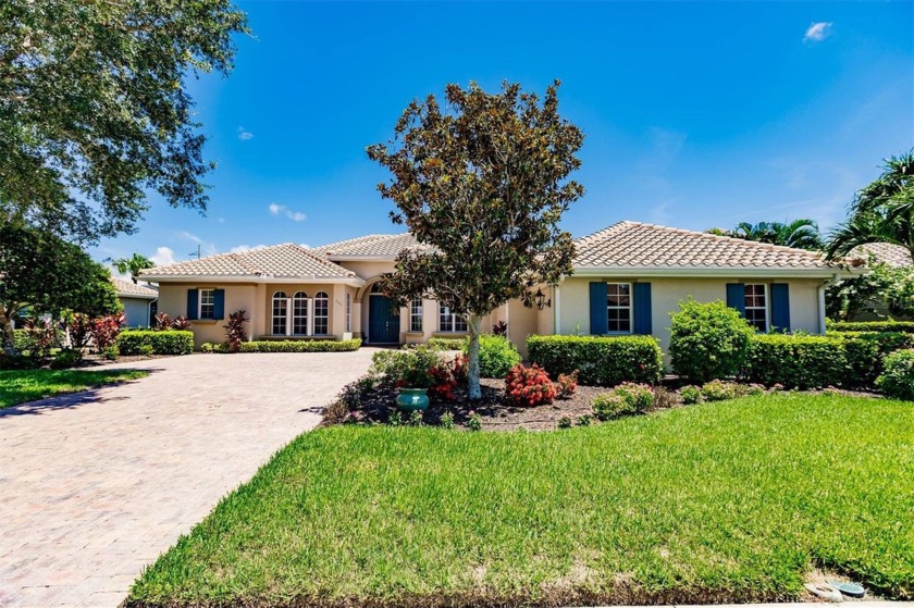 This stunning Mediterranean style stucco home is on a golf - Beach Home for sale in Venice, Florida on Beachhouse.com