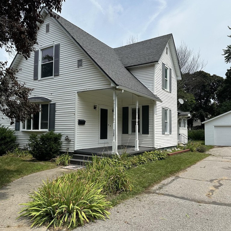 Located in the Village of Spring Lake! The welcoming front porch - Beach Home for sale in Spring Lake, Michigan on Beachhouse.com