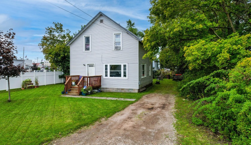 Welcome to 509 W First St! This 4-bedroom, 2-bath home is - Beach Home for sale in Cheboygan, Michigan on Beachhouse.com