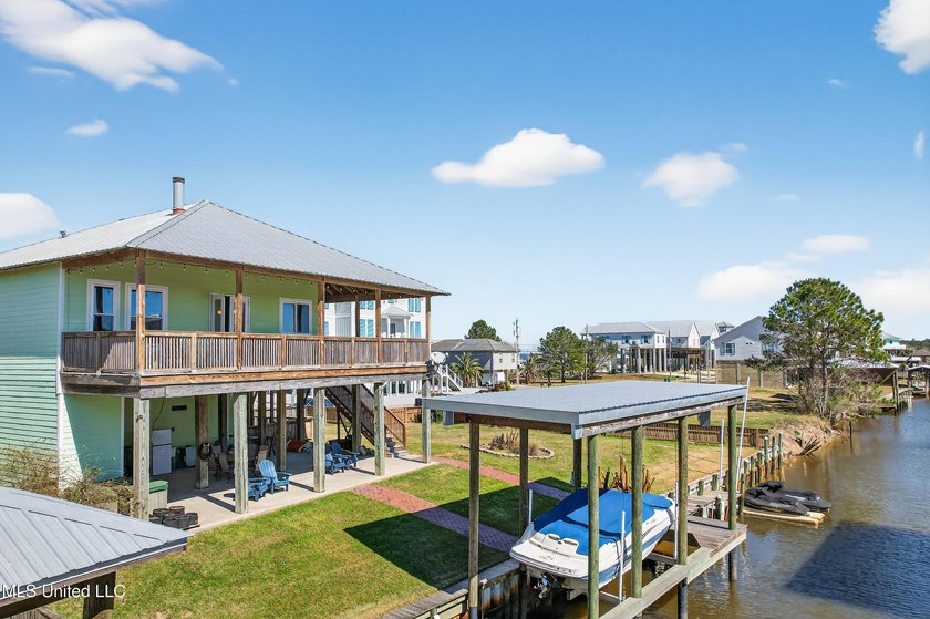 Welcome to 117 Janelle Drive, an exceptional waterfront home on - Beach Home for sale in Bay Saint Louis, Mississippi on Beachhouse.com