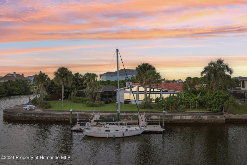 Waterfront living, Love where you live.. This home is on about a - Beach Home for sale in Hernando Beach, Florida on Beachhouse.com