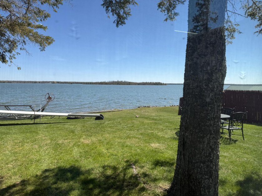 TURN KEY GRAND LAKE WATERFRONT!!! 102' On highly desirable area - Beach Home for sale in Presque Isle, Michigan on Beachhouse.com