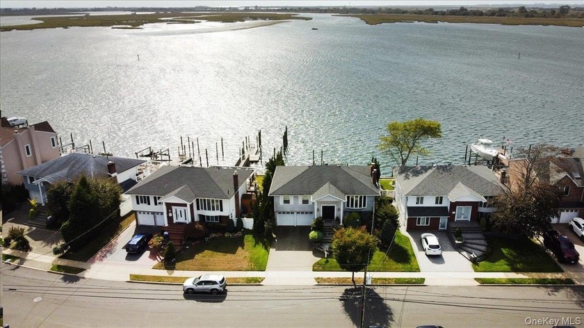 Welcome to this exceptional waterfront home - offering not just - Beach Home for sale in Merrick, New York on Beachhouse.com