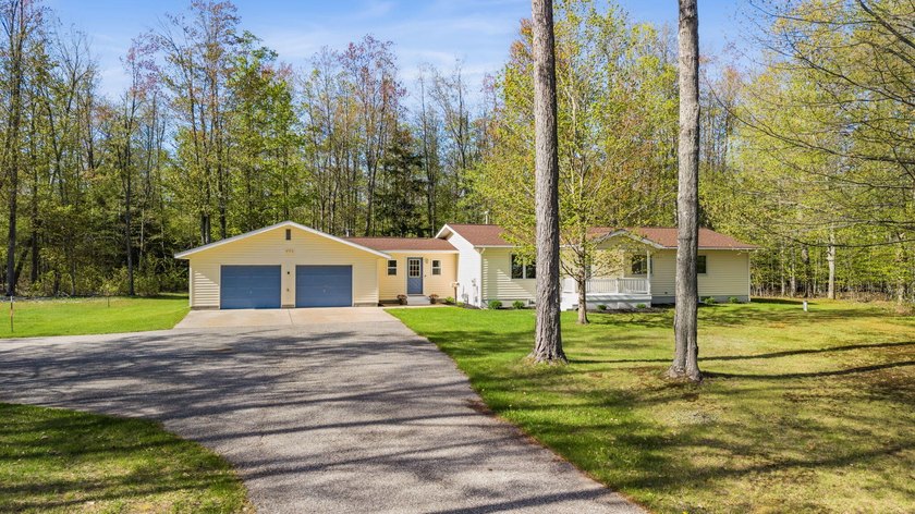 Charming 3-bedroom, 2-bath home nestled on 7 acres of beautiful - Beach Home for sale in Cheboygan, Michigan on Beachhouse.com