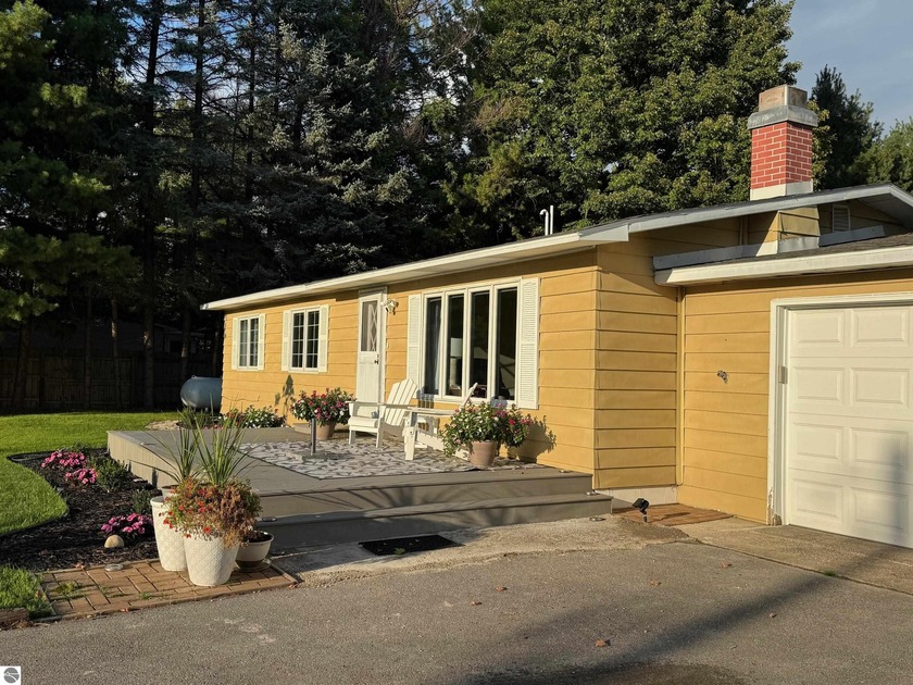 Welcome to this beautifully remodeled three-bedroom, two-bath - Beach Home for sale in Williamsburg, Michigan on Beachhouse.com