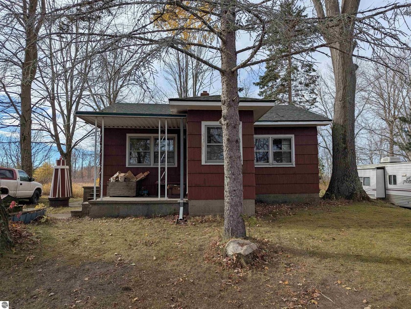 Sitting on nearly an acre of land and along a small canal, this - Beach Home for sale in Au Gres, Michigan on Beachhouse.com