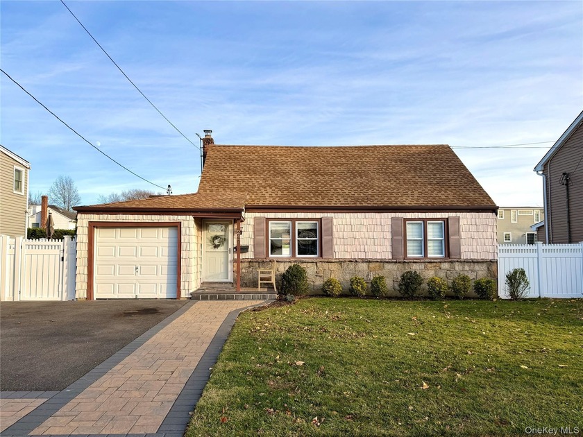 Welcome to this charming 4-bedroom, 1.5-bath Cape Cod located in - Beach Home for sale in Massapequa, New York on Beachhouse.com