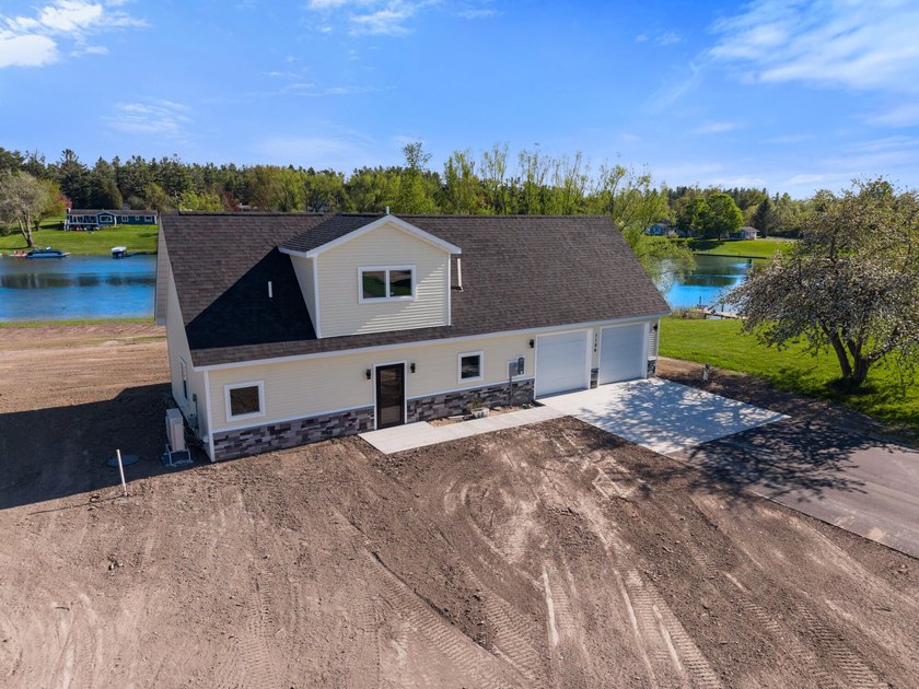 Brand new construction on the beautiful Cheboygan River! Enjoy - Beach Home for sale in Cheboygan, Michigan on Beachhouse.com