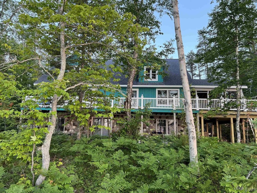 Wake up to panoramic Superior views in this five bedroom, two - Beach Home for sale in Grand Marais, Michigan on Beachhouse.com