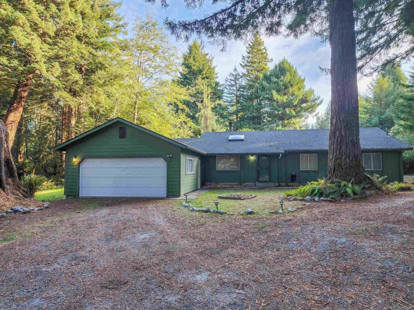 Located amidst towering redwood trees, this 3 bedroom, 2 bath - Beach Home for sale in Crescent City, California on Beachhouse.com