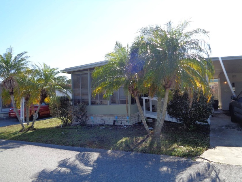 AFFORDABLE 2/2 MOSTLY FURNISHED. THERE IS A RAMP IN THE FRONT - Beach Home for sale in New Port Richey, Florida on Beachhouse.com