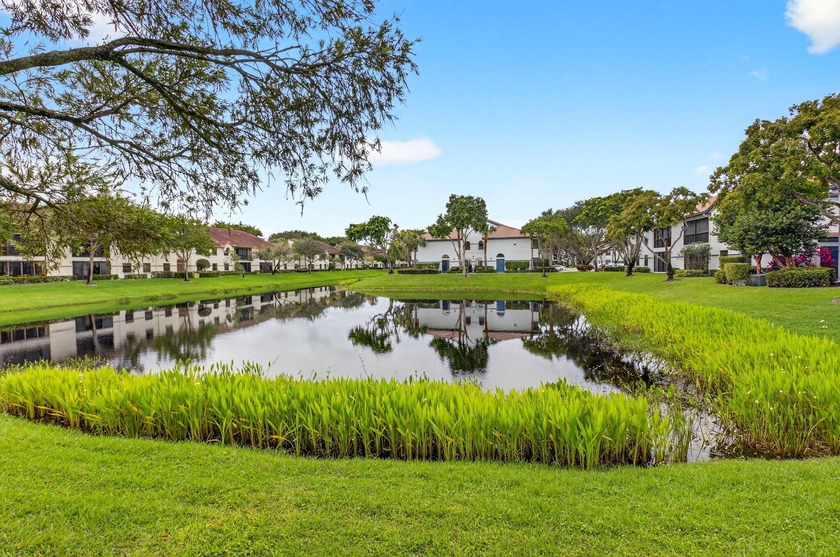Stunning LAKE VIEWS await in this sought-after 1ST floor Grandi - Beach Condo for sale in Boynton Beach, Florida on Beachhouse.com