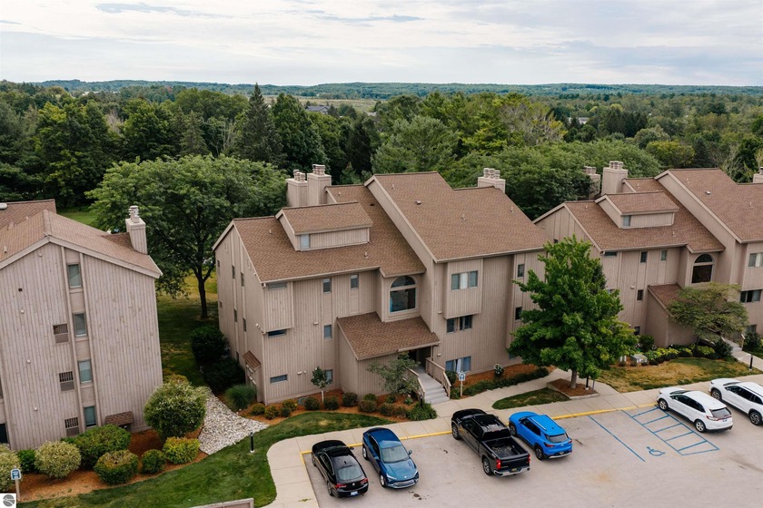 Perched above the third tee of Spruce Run Golf Course, this - Beach Condo for sale in Williamsburg, Michigan on Beachhouse.com