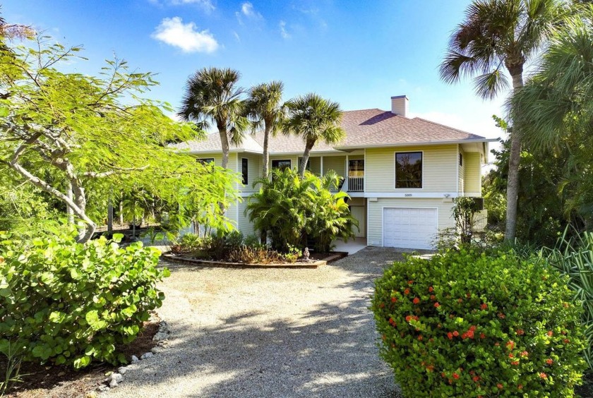 The private end-of-cul-de-sac location of this elevated home has - Beach Home for sale in Sanibel, Florida on Beachhouse.com