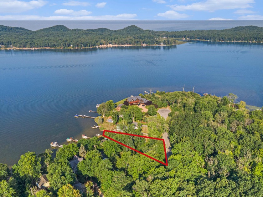 This prime undeveloped lot on Bass Lake offers a perfect - Beach Lot for sale in Pentwater, Michigan on Beachhouse.com