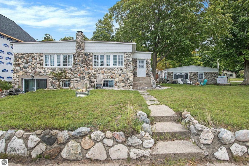 Rare Stone Cottages with 57' of Portage Lake Frontage! An - Beach Home for sale in Onekama, Michigan on Beachhouse.com